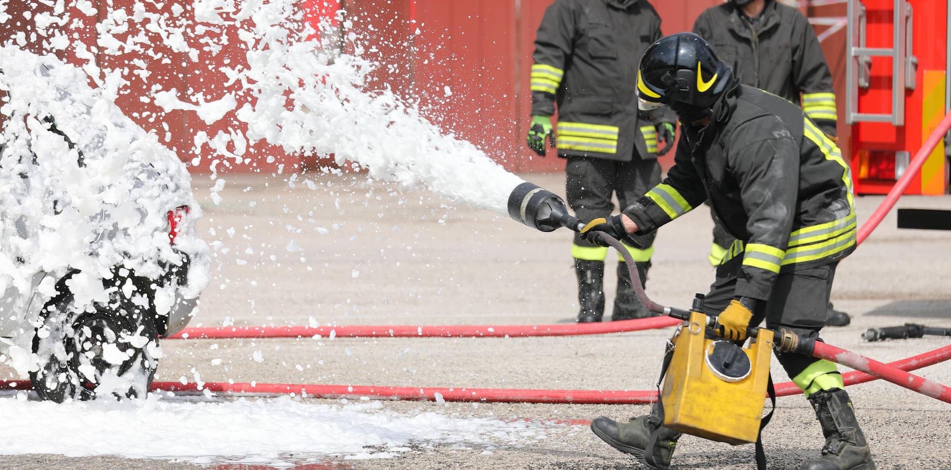 Firefighters using firefighting foam